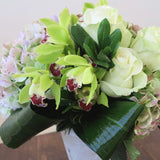 Flowers used: green roses, rusty green hydrangeas, chartreuse cymbidium orchids
