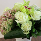 Flowers used: green roses, rusty green hydrangeas, chartreuse cymbidium orchids