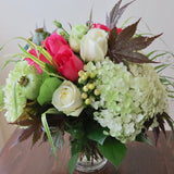 Flowers used: pink and white roses, white lisianthus, green poppy seedpods, white hypericum berries, green hydrangeas