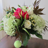 Flowers used: pink and white roses, white lisianthus, green poppy seedpods, white hypericum berries, green hydrangeas