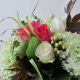 Flowers used: pink and white roses, white lisianthus, green poppy seedpods, white hypericum berries, green hydrangeas