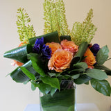 Flowers used: orange roses, yellow eremurus, purple lisianthus