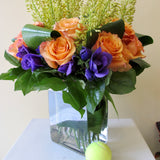 Flowers used: orange roses, yellow eremurus, purple lisianthus