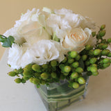 Flowers used: white roses, white lisianthus, green hypericum berries