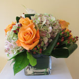 Flowers used: orange roses, white calla lilies, mauve hydrangeas, hypericum berries