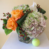Flowers used: orange roses, white calla lilies, mauve hydrangeas, hypericum berries