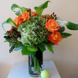 Flowers used: orange roses, green calla lilies, green hydrangeas, hypericum berries