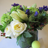 Flowers used: white roses, blue anemones, white amaryllis, green hydrangeas, red hypericum berries