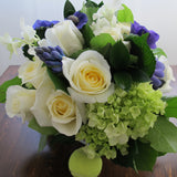Flowers used: cream white roses, blue anemones, purple hyacinths, white orchids