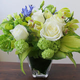 Flowers used: white roses, green viburnum, chartreuse cymbidium orchids, blue agapanthus