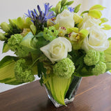 Flowers used: white roses, green viburnum, chartreuse cymbidium orchids, blue agapanthus