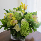 Flowers used: white roses, green viburnum, white lilies, yellow orchids