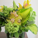 Flowers used: white roses, green viburnum, white lilies, yellow orchids
