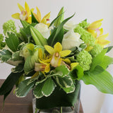 Flowers used: white roses, green viburnum, white lilies, yellow orchids