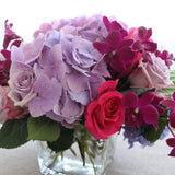 Flowers used: mauve roses, mauve hydrangeas, burgundy orchids, pink roses