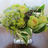 Flowers used: chartreuse roses, white lisianthus, blue blush hydrangeas, chartreuse lady’s mantles, poppy seed pods