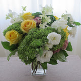 Flowers used: green hydrangeas, yellow roses, white lisianthus, white orchids, pink sedums, green kales