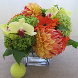 Flowers used: orange dahlias, orange gerberas, yellow cymbidium orchids, green hydrangeas