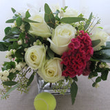 Flowers used: white roses, white orchids, pink celosias, seeded eucalyptus, white berries