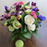 Flowers used: cream white roses, white gerberas, chartreuse lisianthus, blue anemones, pink mini roses, purple orchids