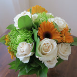 Flowers used: cream roses, orange gerberas, green mums