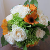 Flowers used: cream roses, orange gerberas, green mums