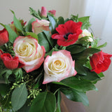 Flowers used: red blush roses, red hot anemones