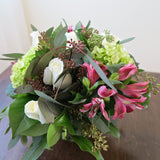 Flowers used: white roses, pink alstroemerias, green hydrangeas, seeded eucalyptus