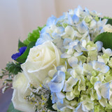 Flowers used: cream white roses, blue anemones, blue hydrangeas, green chrysanthemums