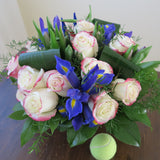 Flowers used: red blush roses, mauve tulips, blue irises