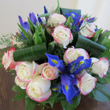 Flowers used: red blush roses, mauve tulips, blue irises