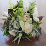 Flowers used: white roses, white calla lilies, white lisianthus, chartreuse lady's mantle