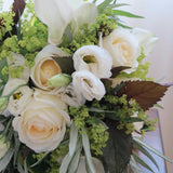 Flowers used: white roses, white calla lilies, white lisianthus, chartreuse lady's mantle