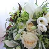 Flowers used: white roses, white calla lilies, white lisianthus, chartreuse lady's mantle