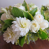 Flowers used: white roses, white dahlias, white orchids, chartreuse lady's mantle, hosta leaves