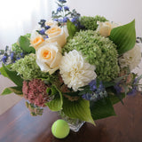Flowers used: green hydrangeas, cream roses, white dahlias, blue spirea, pink sedums, hosta leaves