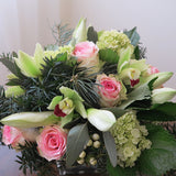Flowers used: chartreuse cymbidium orchids, white amaryllis, pink roses, green hydrangeas, white hypericum berries