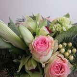Flowers used: chartreuse cymbidium orchids, white amaryllis, pink roses, green hydrangeas, white hypericum berries