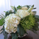 Flowers used: cream roses, white amaryllis, white hydrangeas, green chrysanthemums and seeded eucalyptus