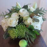 Flowers used: cream roses, white amaryllis, white hydrangeas, green chrysanthemums and seeded eucalyptus