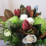 Flowers used:  cream roses, green chrysanthemums, red amaryllis, white lisianthus, magnolia leaves, evergreens boughs