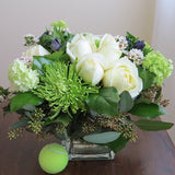 Flowers used: white roses, green chrysanthemums and viburnums blue/purple anemones, wax flowers, seeded eucalyptus