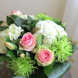 Flowers used: pink blush roses, green chrysanthemums, red tulips, white hydrangeas, seeded eucalyptus