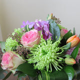Flowers used: pink blush roses, green chrysanthemums, mauve hyacinths and orchids, red tulips, seeded eucalyptus