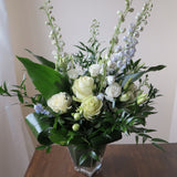Flowers used: green roses, white lisianthus, blue delphiniums