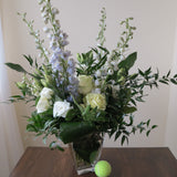 Flowers used: green roses, white lisianthus, blue delphiniums