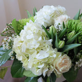 Flowers used: white roses, green chrysanthemums, white tulips, white wax flowers