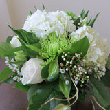 Flowers used: white roses, green chrysanthemums, white tulips, white wax flowers