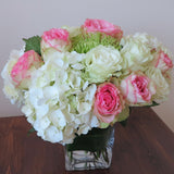 Flowers used: pink blush and white roses, green chrysanthemums, white hydrangeas