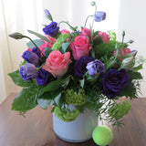 Flowers used: purple lisianthus, pink roses and, green viburnum